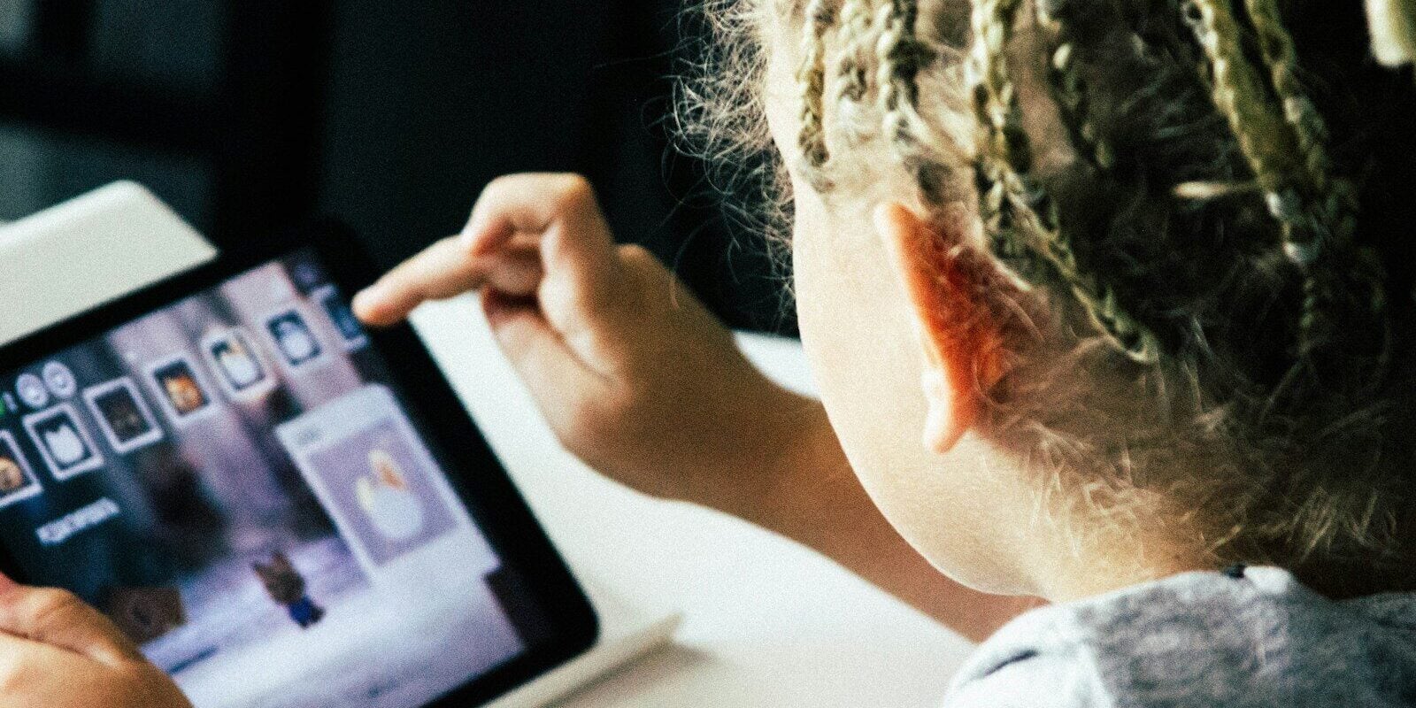 girl operating tablet computer
